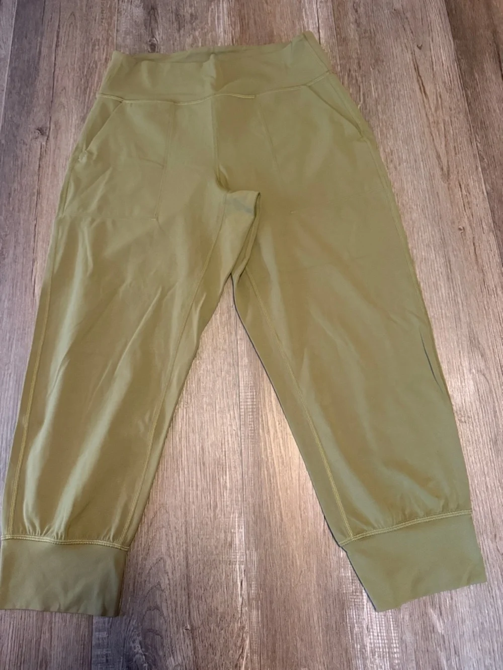 Lululemon Align High-Rise Cropped Jogger Capris in a bronze green color.